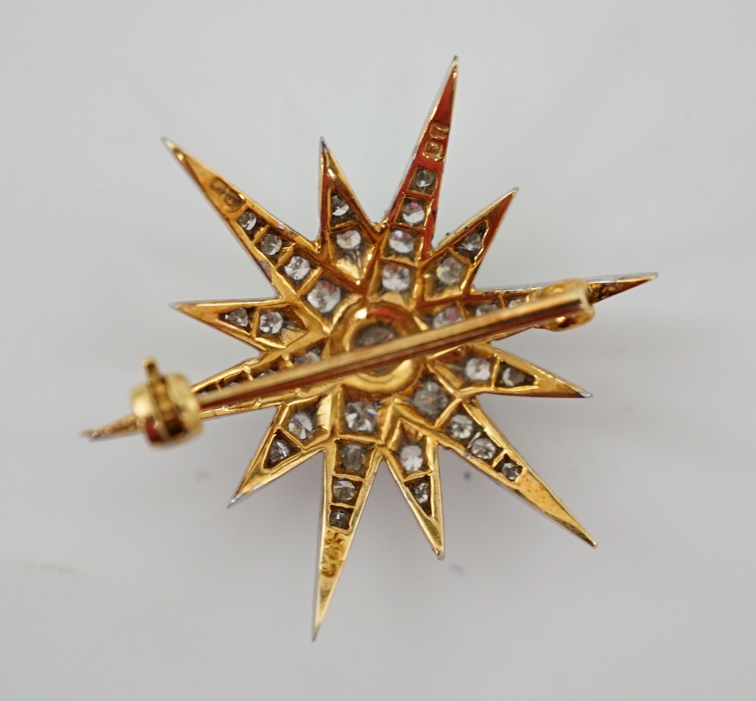 An Edwardian gold and diamond cluster set starburst brooch